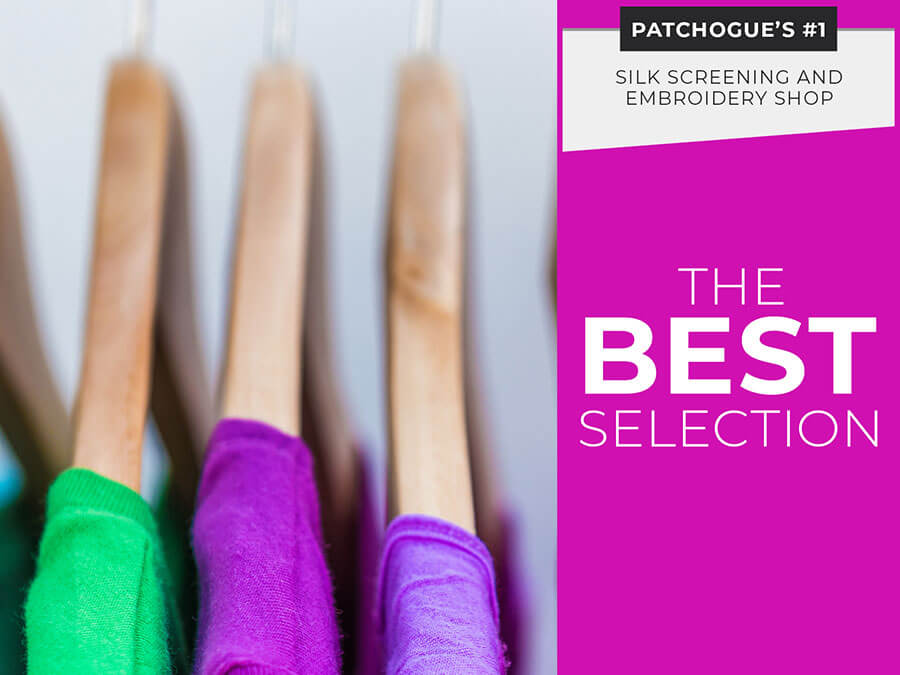 Close-up of colorful shirts on wooden hangers with text promoting Patchogue’s top silk screening and embroidery shop and the best selection.