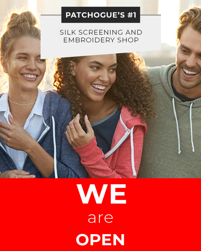 Three people wearing casual hoodies smile together. Text reads: "Patchogue's #1 silk screening and embroidery shop. WE are OPEN.